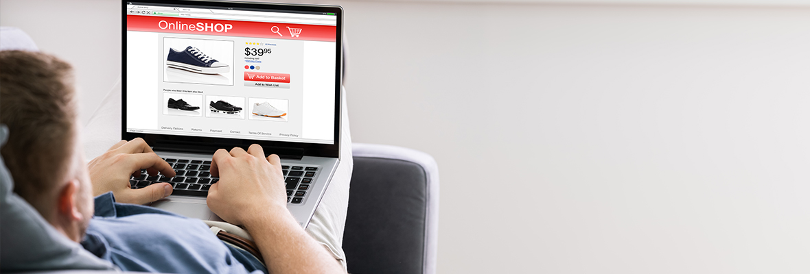man searching for shoe options online