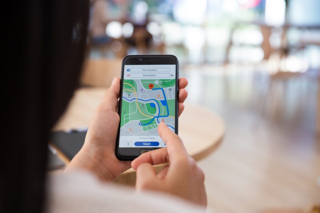 Person looking up location on mobile phone