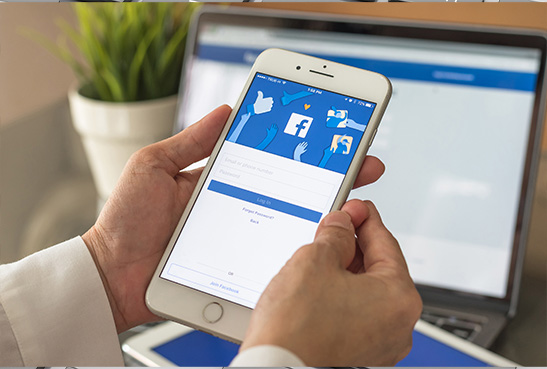 person using facebook on both mobile and desktop