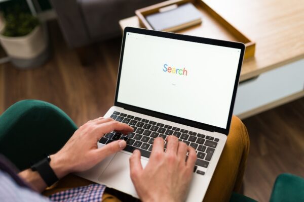 Man using search engine on a laptop.