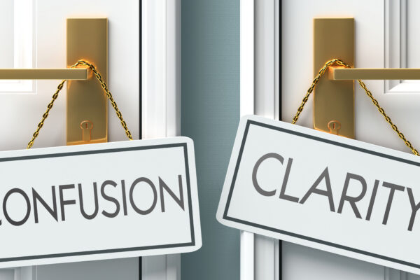 Two doors with gold handles; one has a sign reading CONFUSION, the other CLARITY. The signs hang from each handle, representing Confusion and clarity concept when it comes to messaging on a website