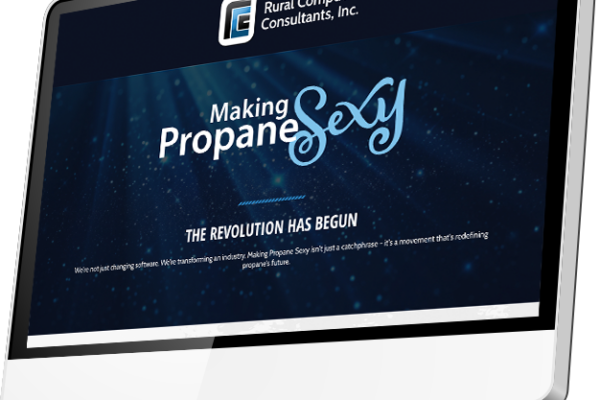 A computer monitor displays a website from Rural Computer Consultants, Inc., with the slogan Making Propane Sexy and the phrase THE REVOLUTION HAS BEGUN on a blue background, prompting viewers to consider questions like "Do I need a landing page?" while exploring their innovative services.